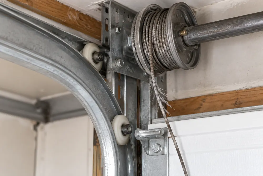 cable and roller repair scene on an unbranded garage door in a Colorado home