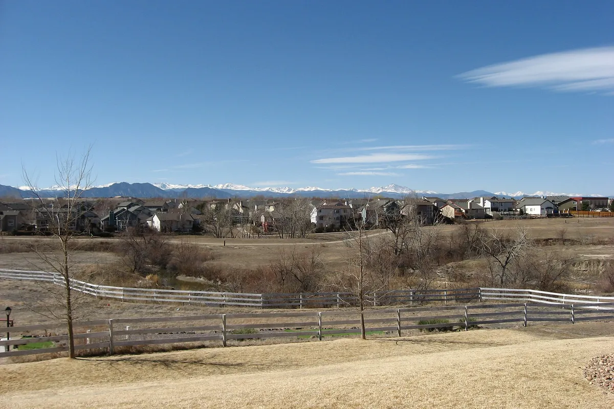 Houses in Westminster, Colorado, with the Rocky Mountains behind